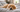 Golden retriever dog lying on a bed, illustrating subtle signs of pet pain.