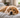 Golden retriever dog lying on a bed, illustrating subtle signs of pet pain.