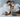 Couple cuddling with Bull Terrier and Abyssinian cat