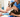 Veterinary technician bandaging a Boston Terrier's leg.