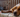 Relaxed Brittany Spaniel dog resting on floral couch