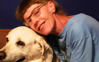 Sandra hugs her dog Cody, a bond like no other.