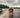 Wet golden retriever on a wooden dock by a lake
