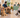 Dog owners and their dogs waiting in a bright veterinary clinic lobby