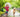 Girl and Golden Retriever run in rain, girl holds umbrella.
