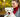 Happy woman cuddling a fluffy white dog in an autumn park.