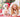 Girl and dog in Santa hats smile for Christmas photo