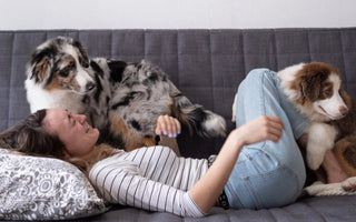 women hugging dog