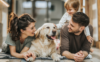 Happy family with Golden Retriever dog