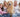 Happy family with Golden Retriever dog on couch