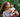 Young woman holding an adorable Siberian Husky puppy