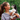 Young woman holding an adorable Siberian Husky puppy